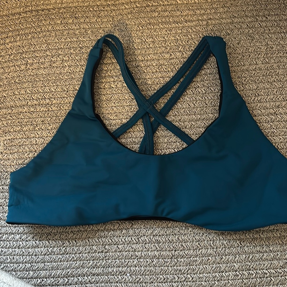 Tera Kaia teal and black sports bra